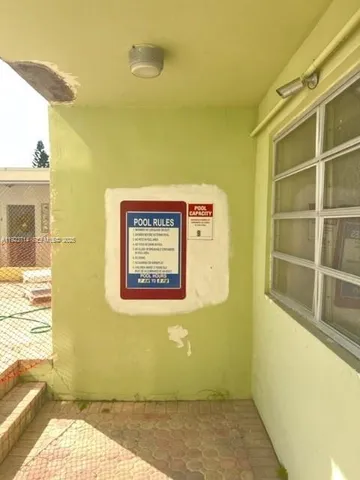 a view of a room with an empty room and painted walls