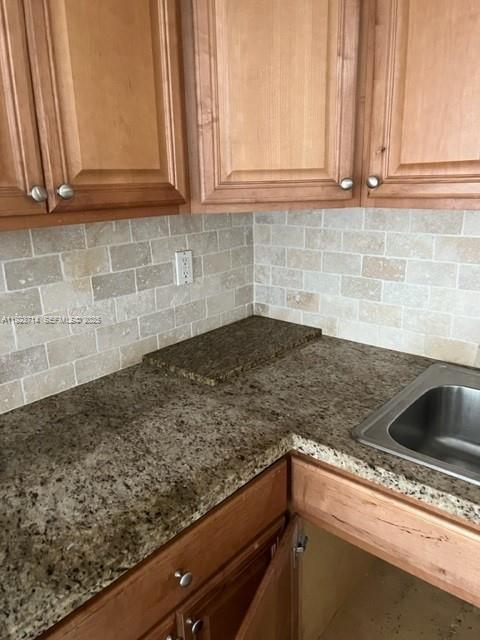 8001 Crespi Boulevard, Unit 2D Miami Beach, FL 33141 - Photo 8 of 20 a kitchen with a sink and cabinets
