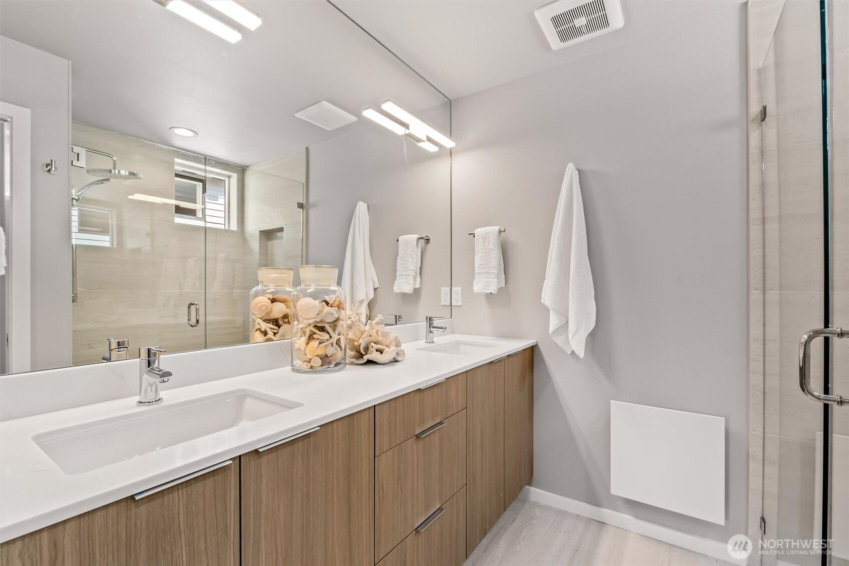 4460 Midvale Avenue North Seattle, WA 98103 - Photo 20 of 40 a bathroom with double sink and a mirror
