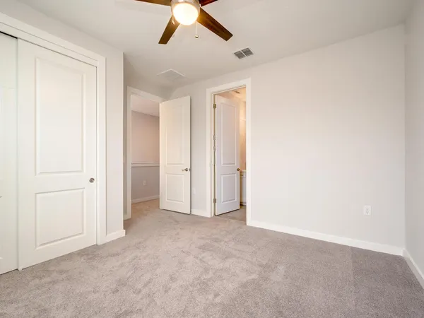 an empty room with fan