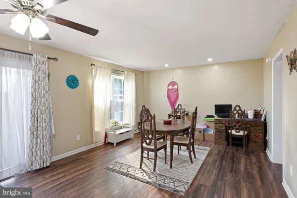 a view of a livingroom with furniture window and wooden floor