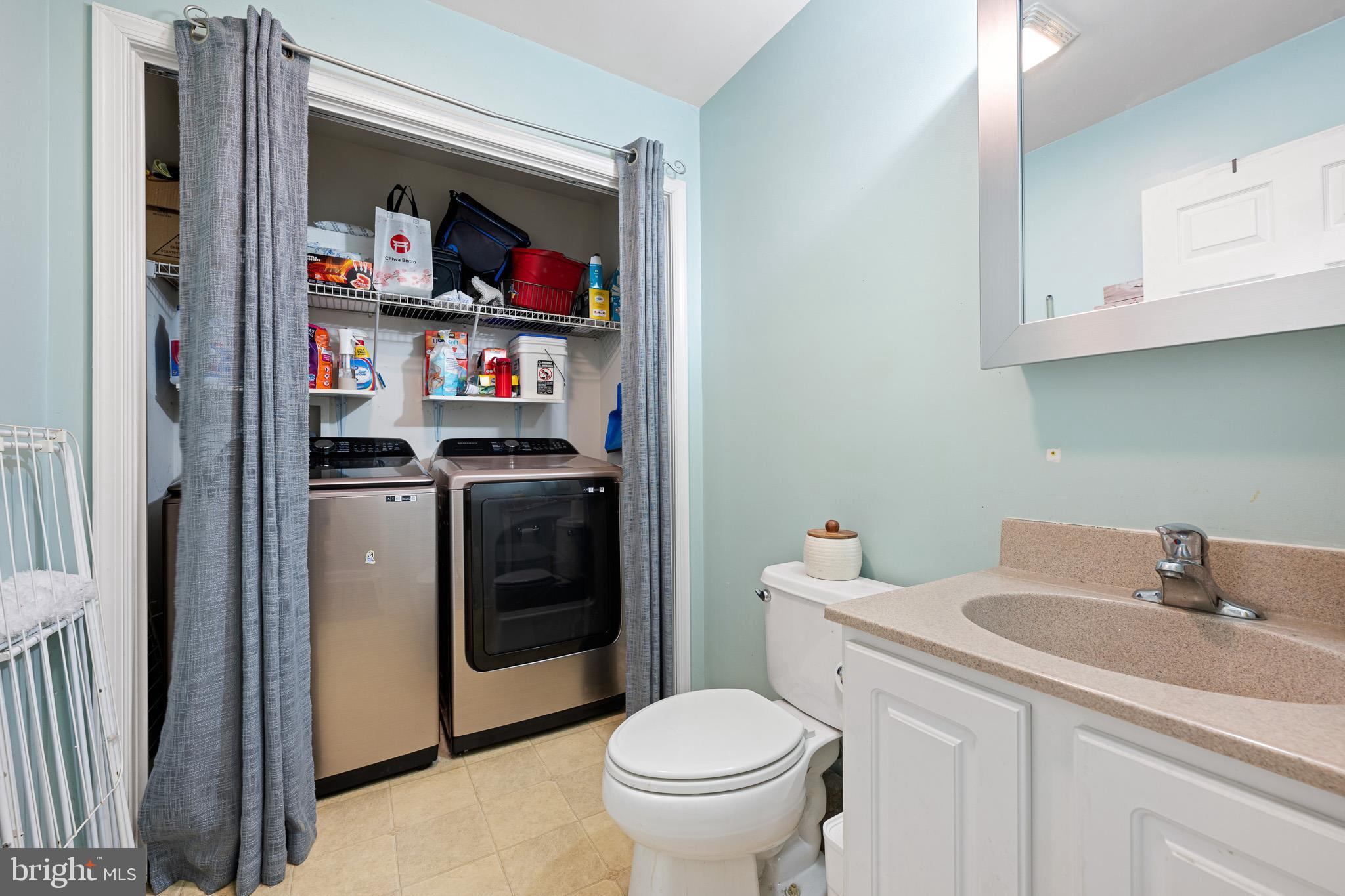 29 East Walnut Street Magnolia, DE 19962 - Photo 20 of 35 a bathroom with a toilet sink and vanity