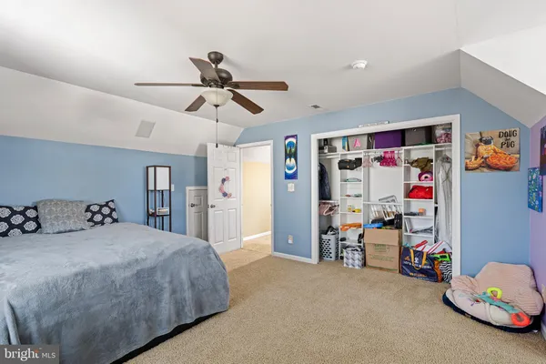 a bedroom with furniture and a chandelier