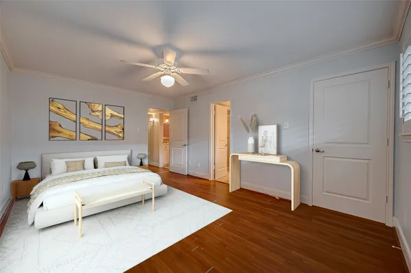 a spacious bedroom with a bed and a dresser