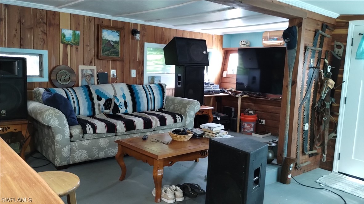 2610 Pine Street Matlacha, FL 33993 - Photo 3 of 11 a living room with furniture and a fireplace