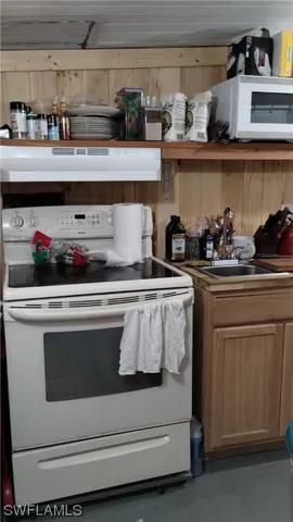 a view of kitchen and microwave