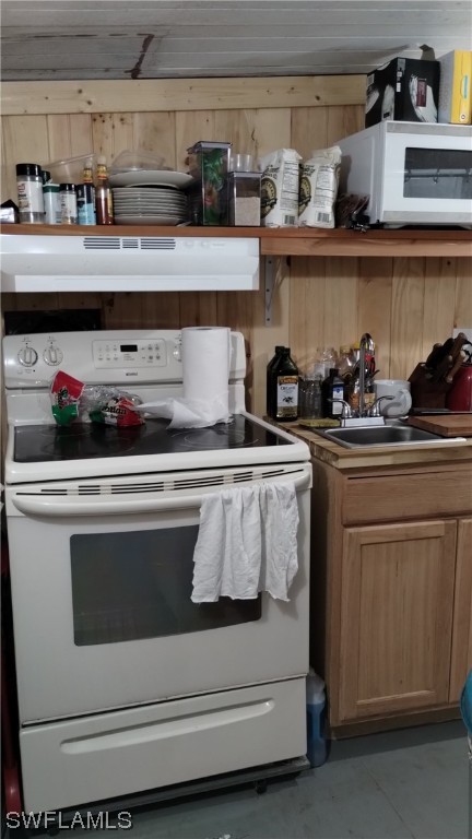 2610 Pine Street Matlacha, FL 33993 - Photo 6 of 11 a kitchen with stove cabinets and a sink