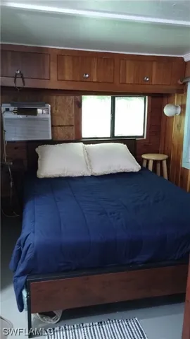 a room with pool table and chairs
