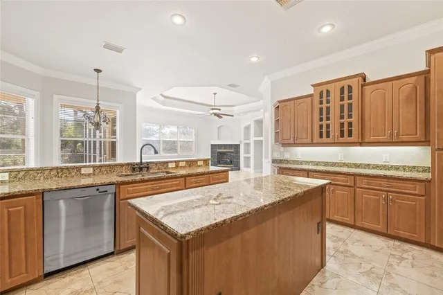 a spacious bedroom with a bed and a large window