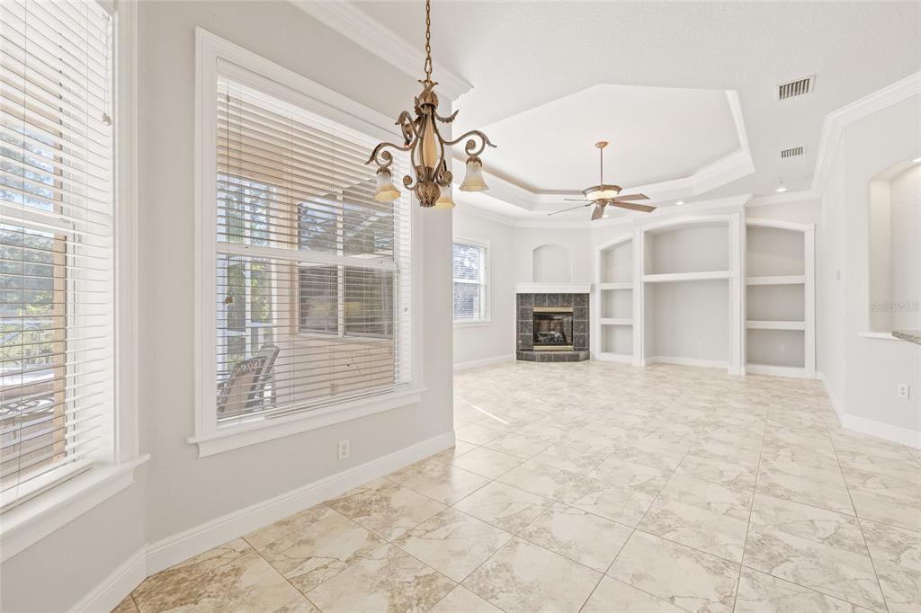11040 Fulton Avenue Weeki Wachee, FL 34613 - Photo 20 of 77 en empty room with windows and a ceiling fan