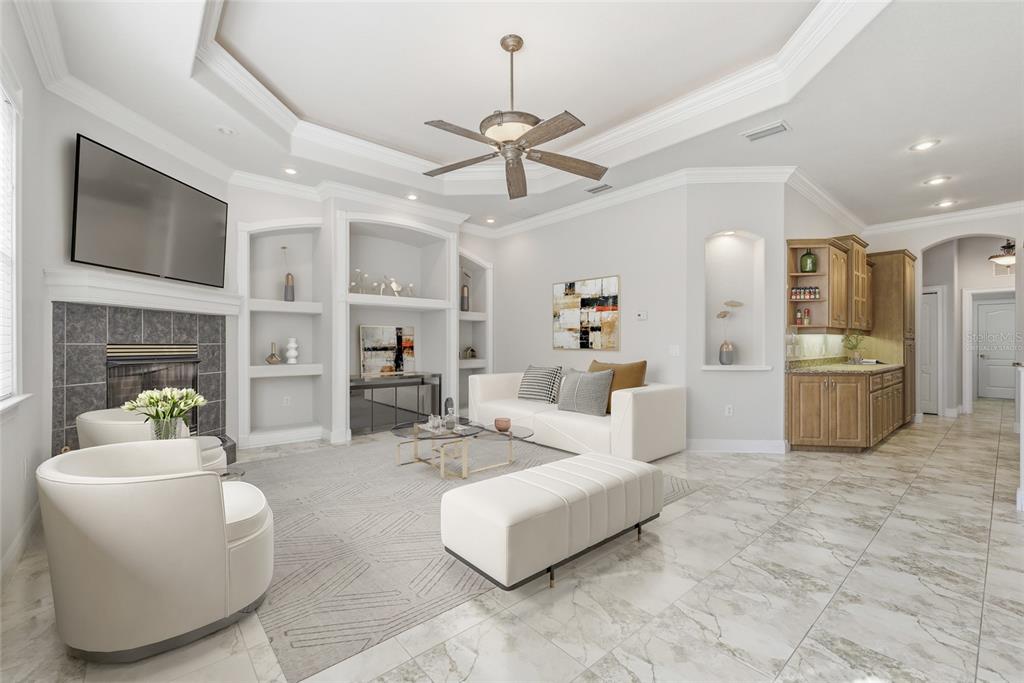 11040 Fulton Avenue Weeki Wachee, FL 34613 - Photo 22 of 77 a living room with furniture a fireplace and a flat screen tv