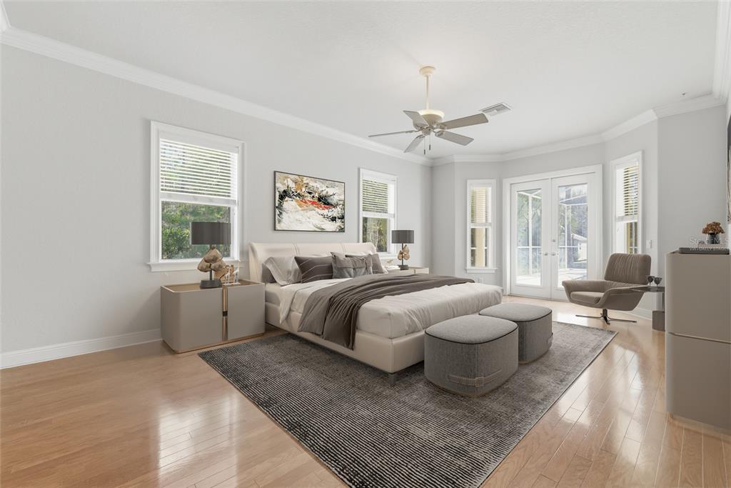 11040 Fulton Avenue Weeki Wachee, FL 34613 - Photo 25 of 77 a spacious bedroom with a bed and a large window