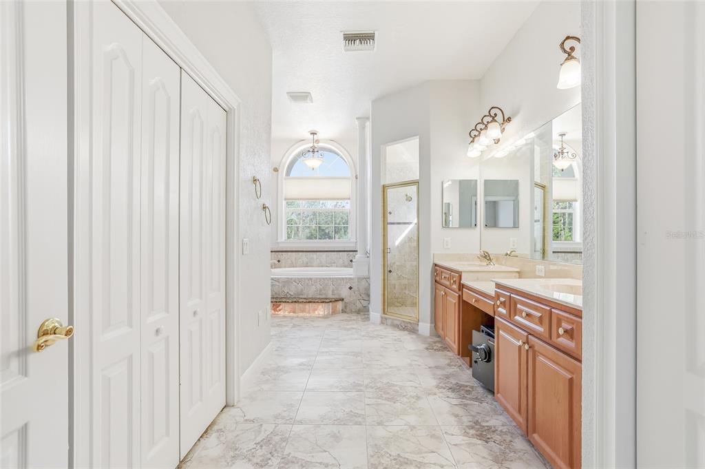 11040 Fulton Avenue Weeki Wachee, FL 34613 - Photo 29 of 77 a large white kitchen with granite countertop a large window and stainless steel appliances