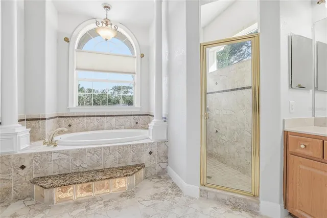 a view of a dining room with furniture wooden floor and chandelier