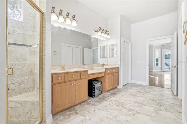 a view of a house with backyard and a tree