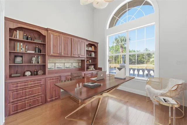 a front view of house with yard and trees