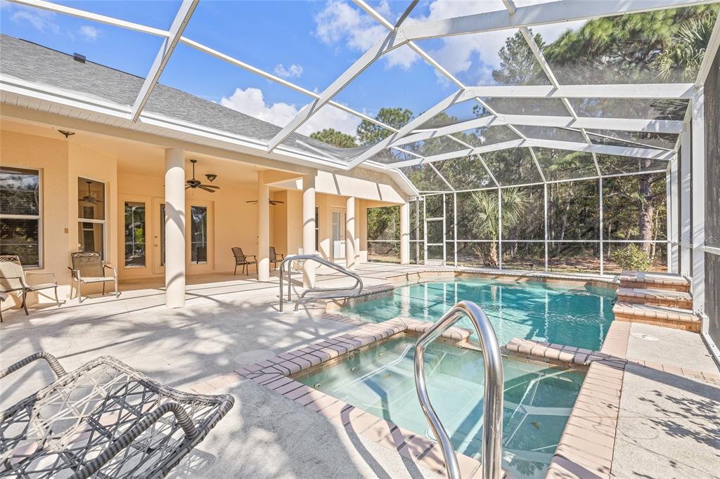 11040 Fulton Avenue Weeki Wachee, FL 34613 - Photo 50 of 77 a view of a porch with a table and chairs