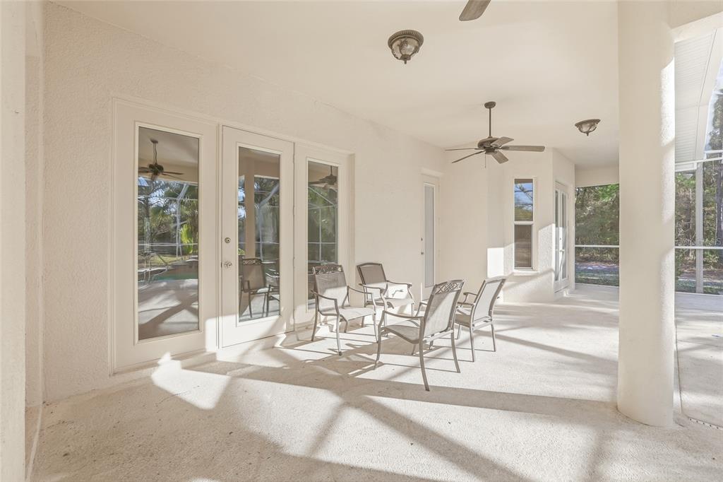 11040 Fulton Avenue Weeki Wachee, FL 34613 - Photo 52 of 77 a view of a dining room with furniture wooden floor and chandelier