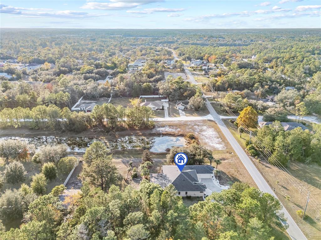 11040 Fulton Avenue Weeki Wachee, FL 34613 - Photo 62 of 77 an aerial view of residential houses with outdoor space