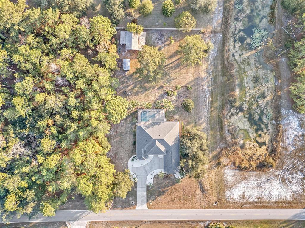11040 Fulton Avenue Weeki Wachee, FL 34613 - Photo 72 of 77 front view of a house with a yard