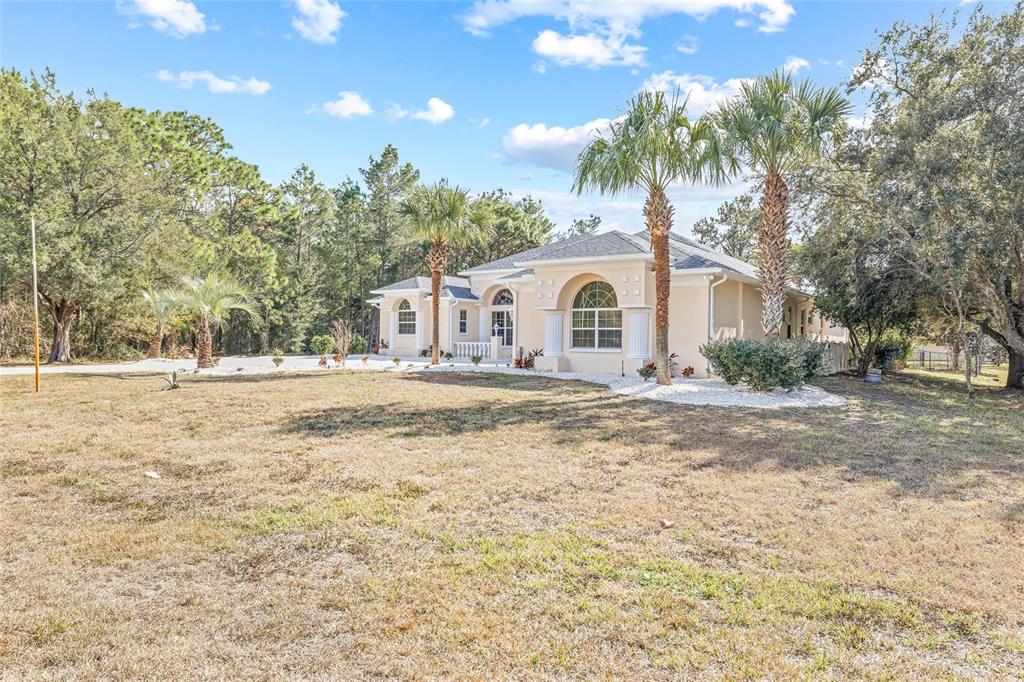 11040 Fulton Avenue Weeki Wachee, FL 34613 - Photo 75 of 77 a view of white house with a swimming pool