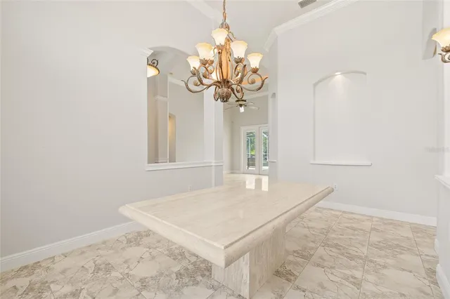 a kitchen with granite countertop a sink stove and cabinets