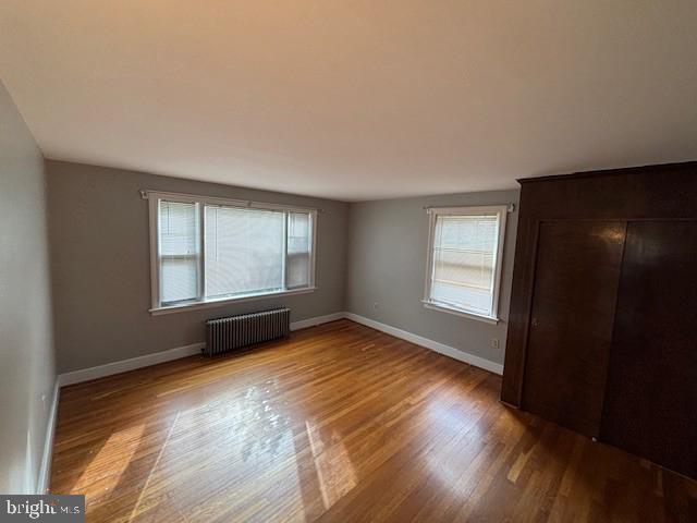 3149 Carlisle Road Dover, PA 17315 - Photo 6 of 10 an empty room with wooden floor and windows