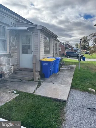 a front view of house with yard and entertaining space