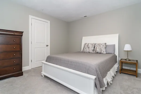 a bedroom with a bed and furniture