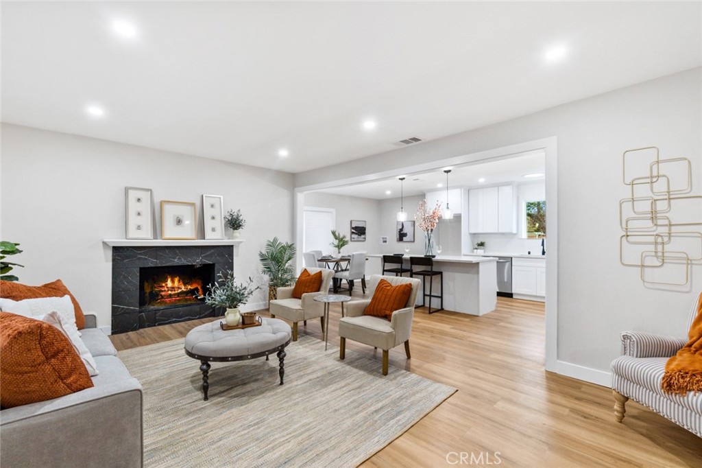 4524 Jones Avenue Riverside, CA 92505 - Photo 1 of 1 a living room with furniture and a fireplace