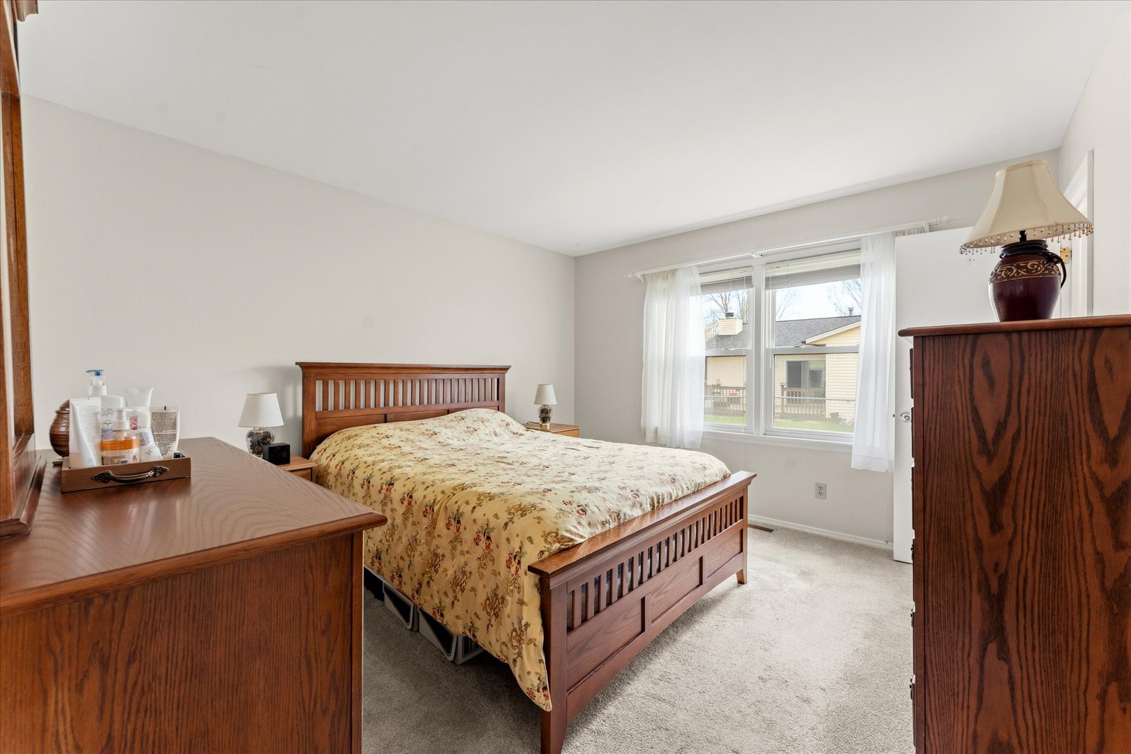 2701 Hathaway Drive Champaign, IL 61821 - Photo 14 of 22 a bedroom with a bed and wooden floor