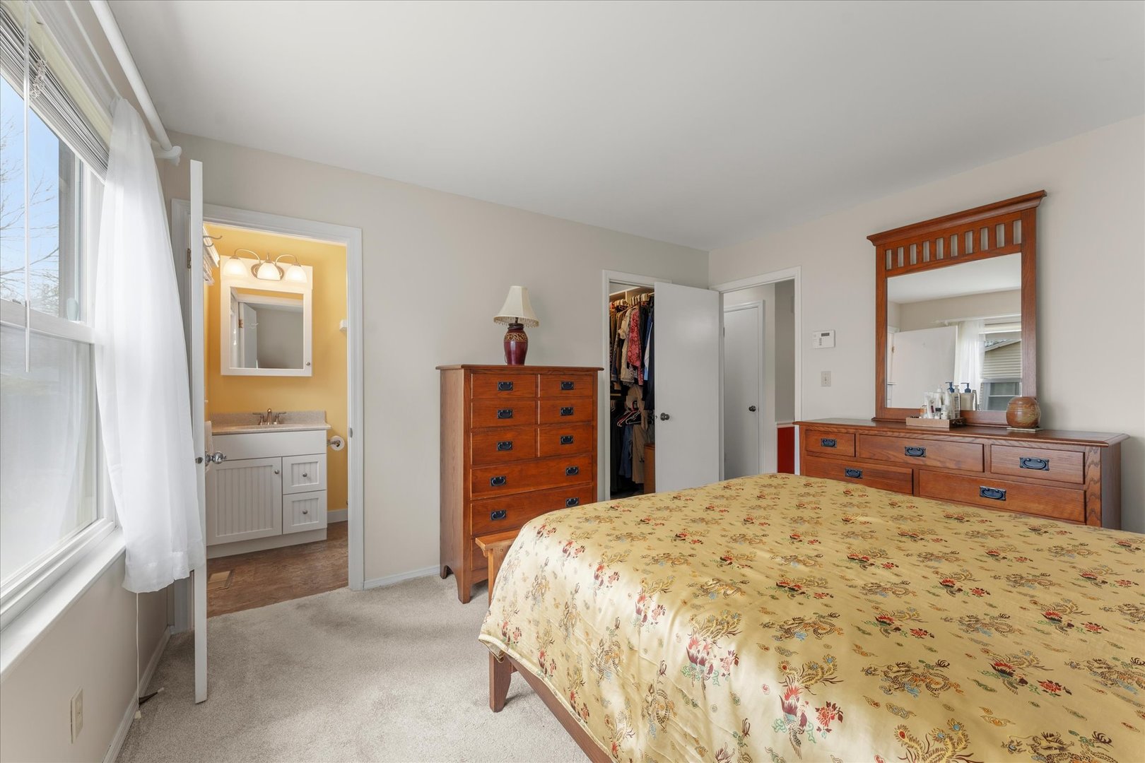 2701 Hathaway Drive Champaign, IL 61821 - Photo 15 of 22 a bedroom with a bed and a dresser