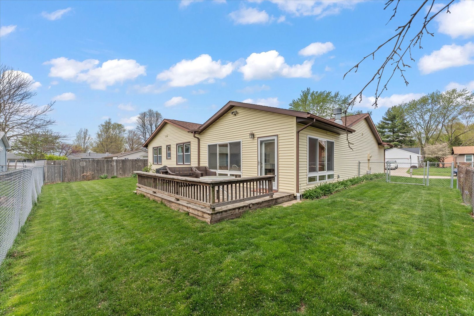 2701 Hathaway Drive Champaign, IL 61821 - Photo 19 of 22 a view of a house with a yard and sitting area