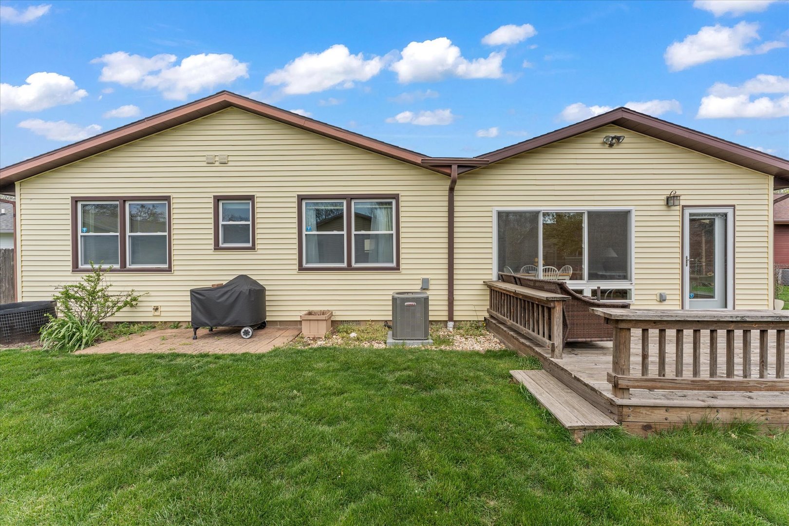 2701 Hathaway Drive Champaign, IL 61821 - Photo 20 of 22 a view of a house with a yard and chairs