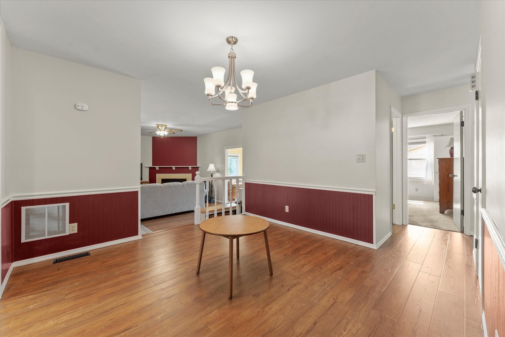 2701 Hathaway Drive Champaign, IL 61821 - Photo 5 of 22 a living room with kitchen island furniture and a wooden floor