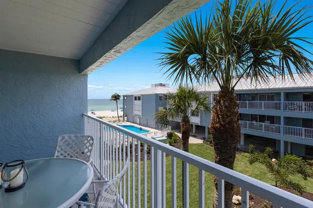 a view of a balcony with a potted plant