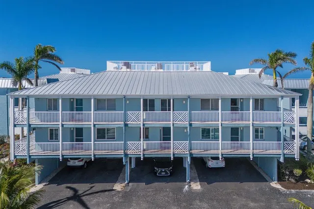 a aerial view of a house with a ocean view