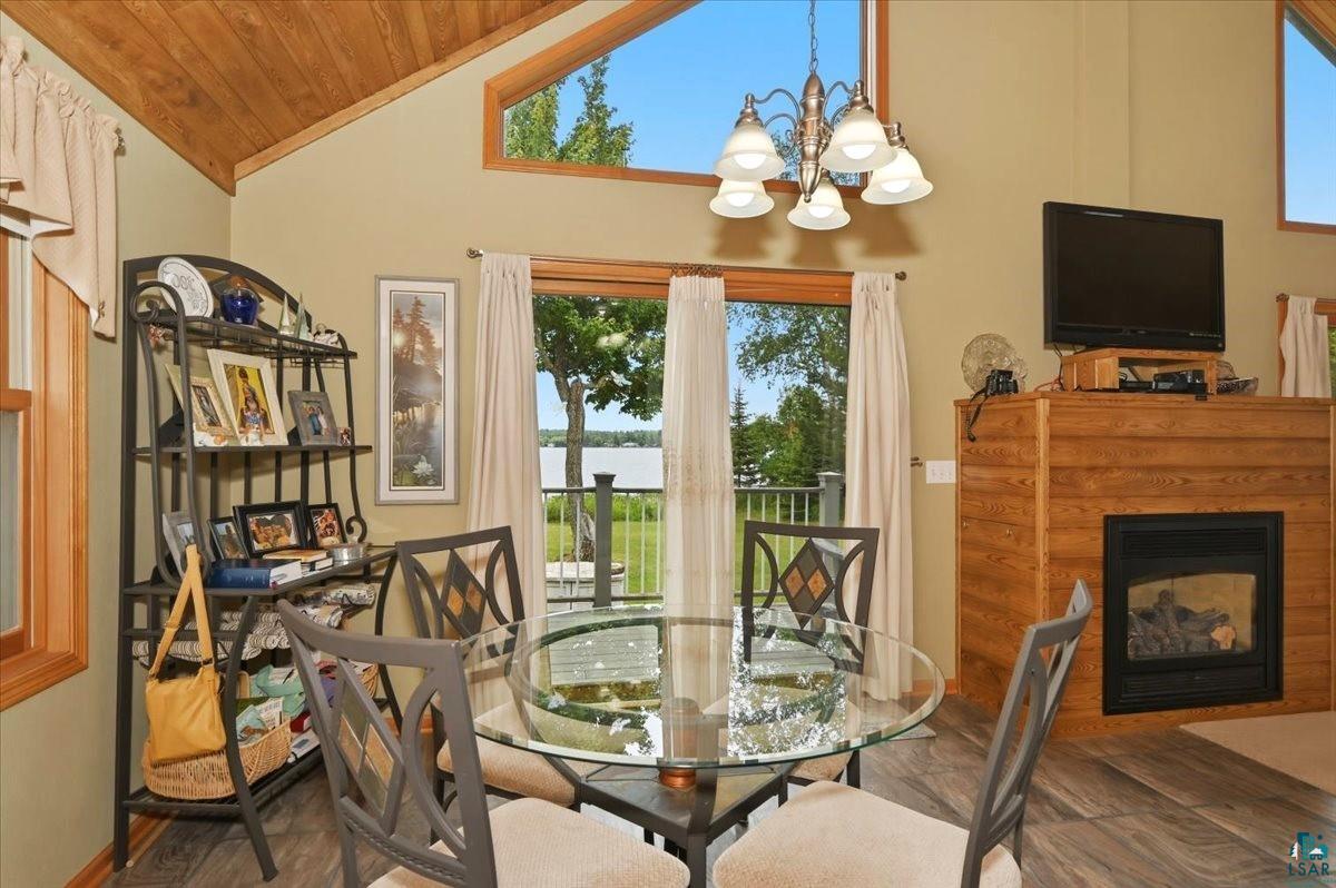 8162 South Dowling Road West Superior, WI 54880 - Photo 6 of 15 Vaulted wood-finish ceiling with exposed beams
