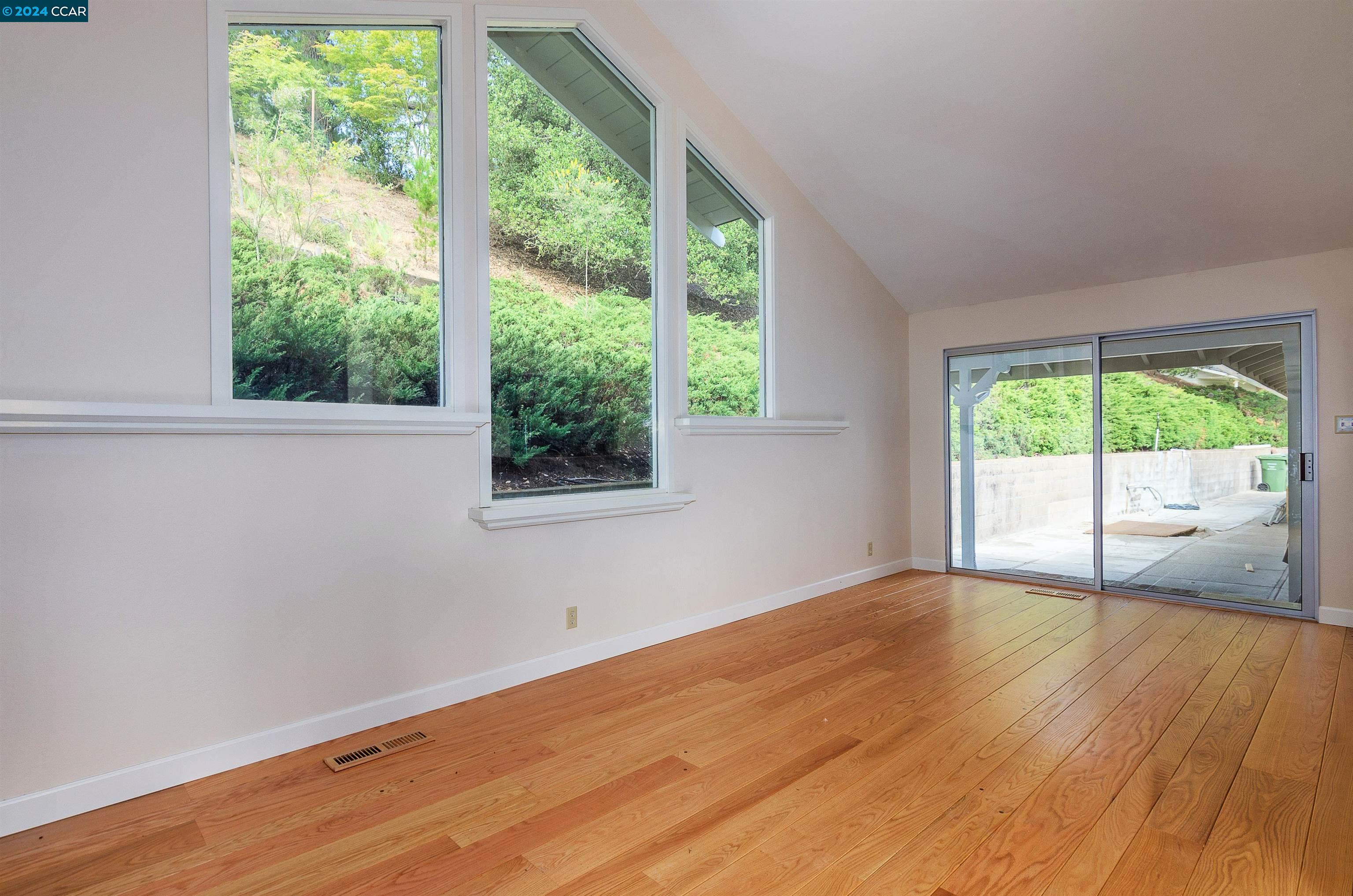 32 Diablo Circle Lafayette, CA 94549 - Photo 11 of 18 a view of an empty room with wooden floor and a window