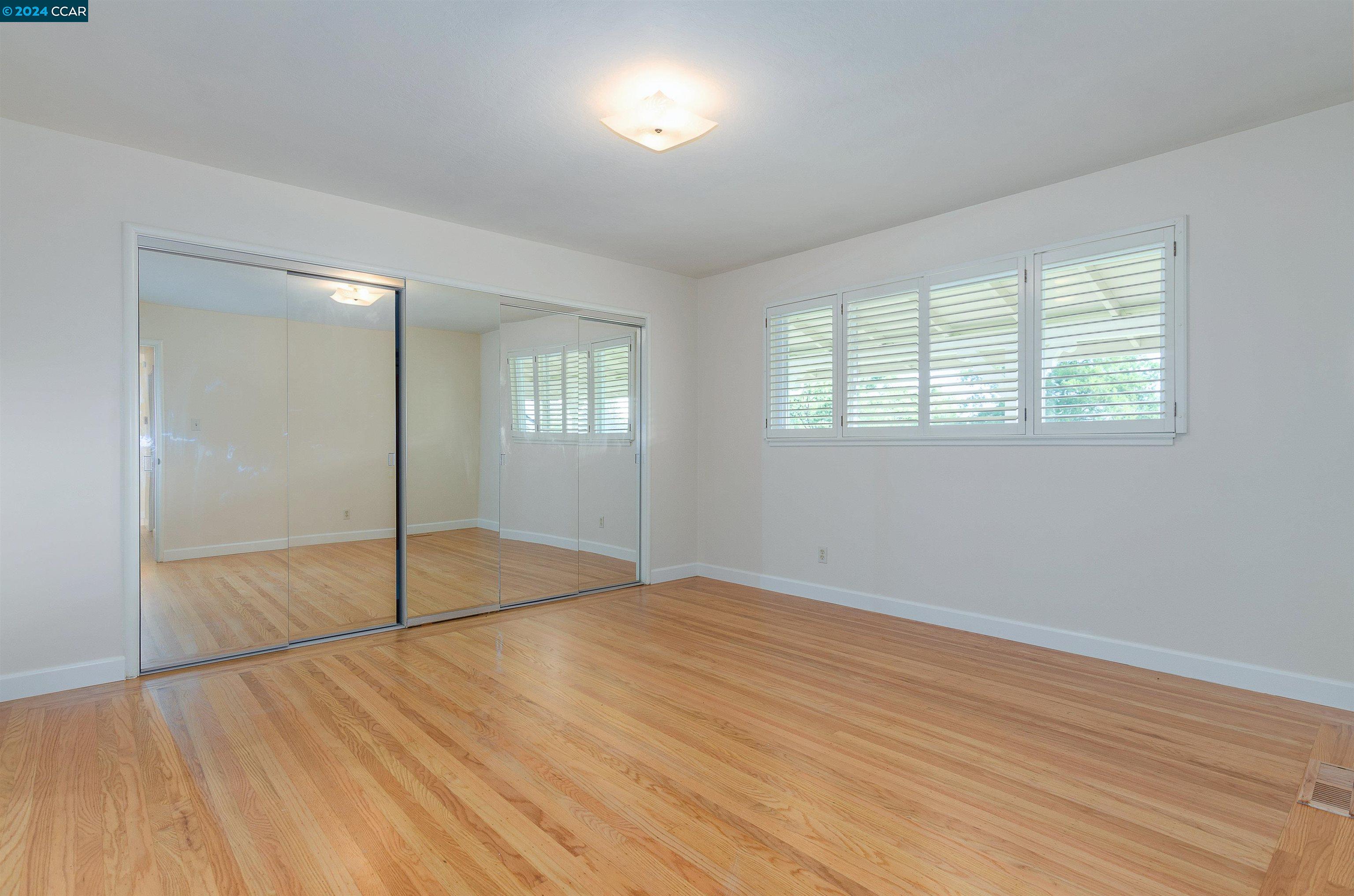 32 Diablo Circle Lafayette, CA 94549 - Photo 15 of 18 a view of an empty room with wooden floor and a window