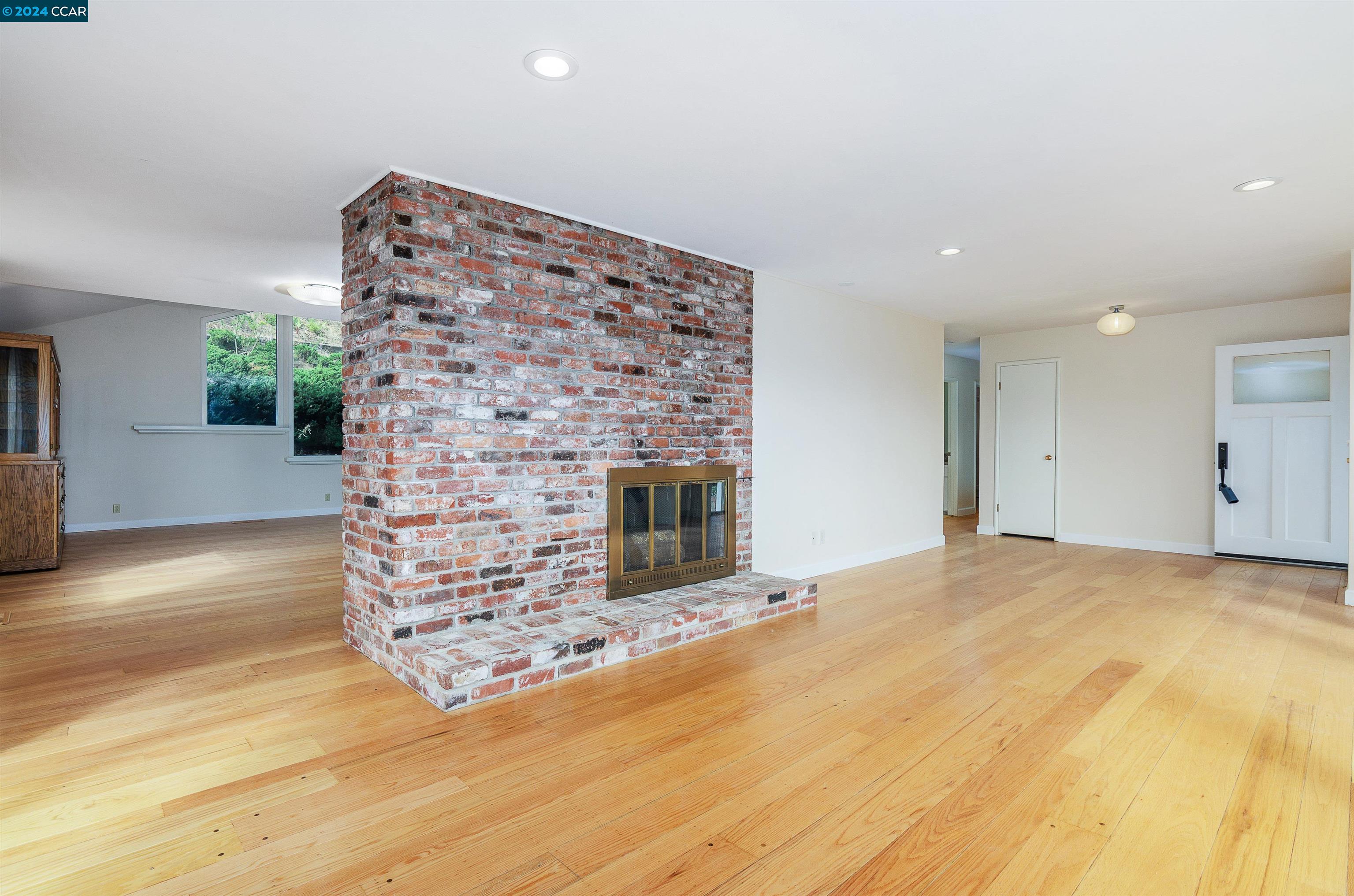 32 Diablo Circle Lafayette, CA 94549 - Photo 5 of 18 a view of an empty room with wooden floor and a fireplace
