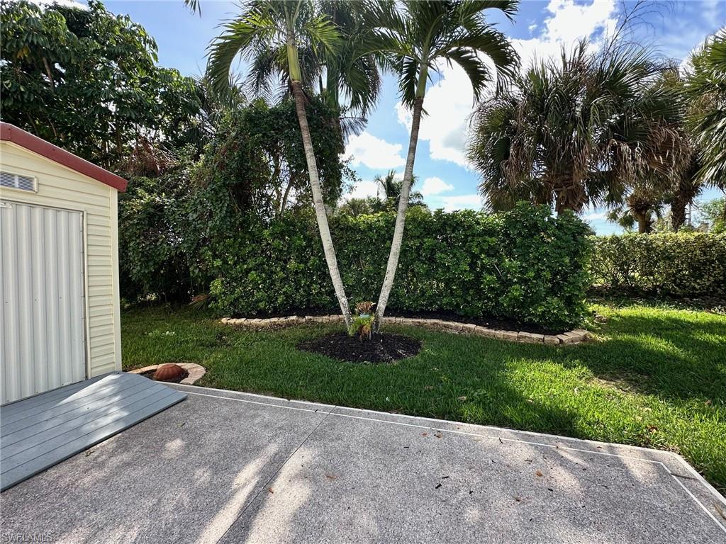 1275 Silver Lakes Boulevard Naples, FL 34114 - Photo 6 of 11 View of grassy yard