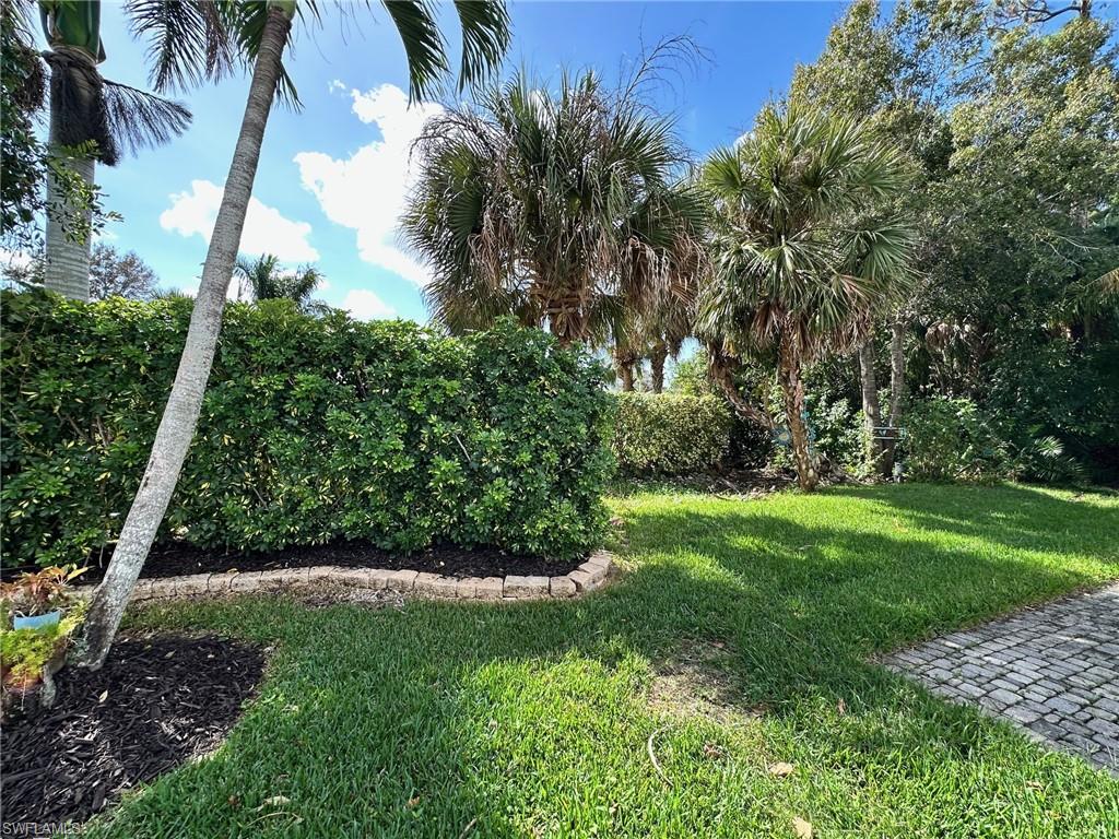 1275 Silver Lakes Boulevard Naples, FL 34114 - Photo 8 of 11 View of green lawn