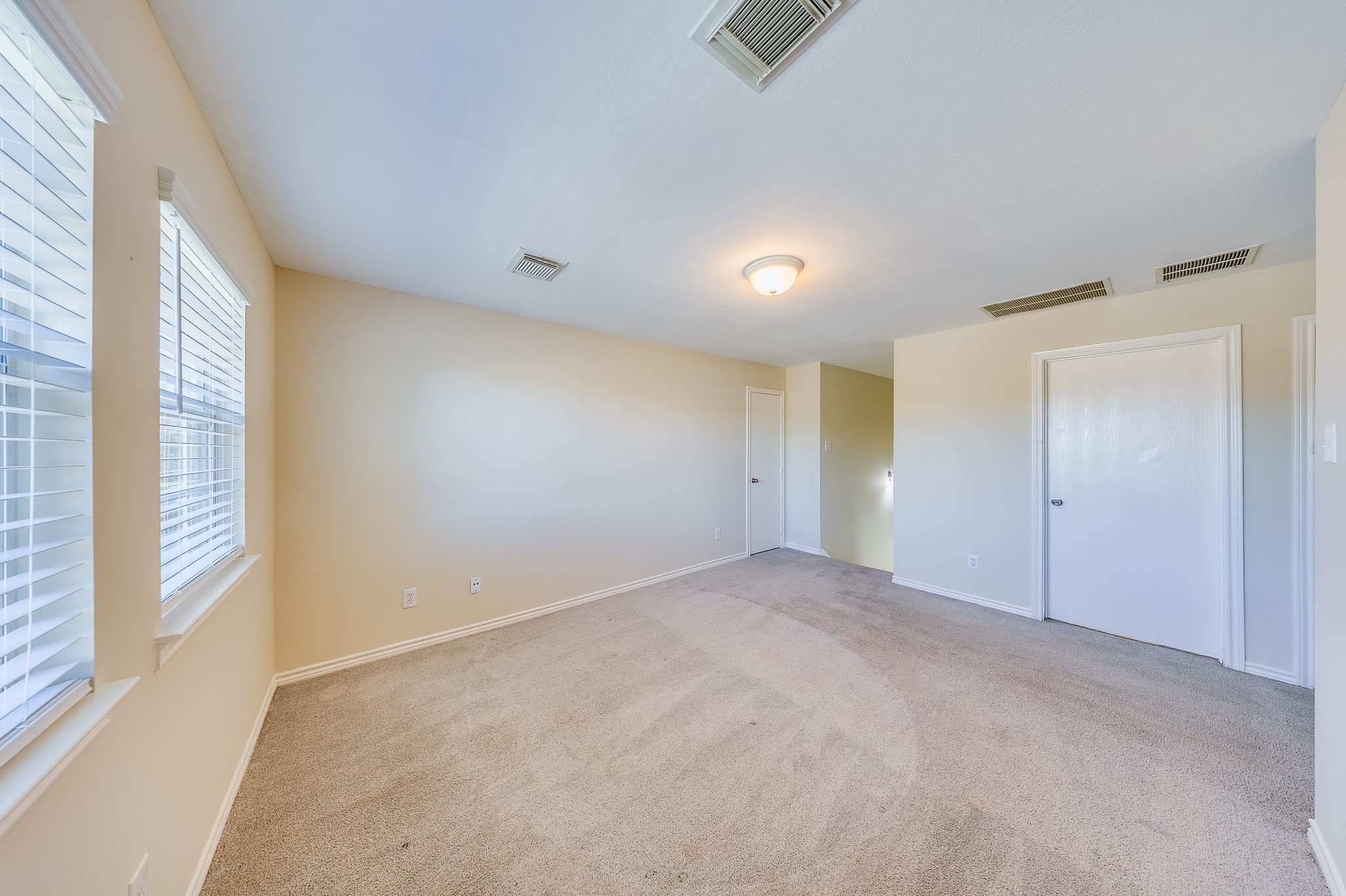 20003 Rustic Lake Lane Cypress, TX 77433 - Photo 13 of 21 a view of an empty room with a window