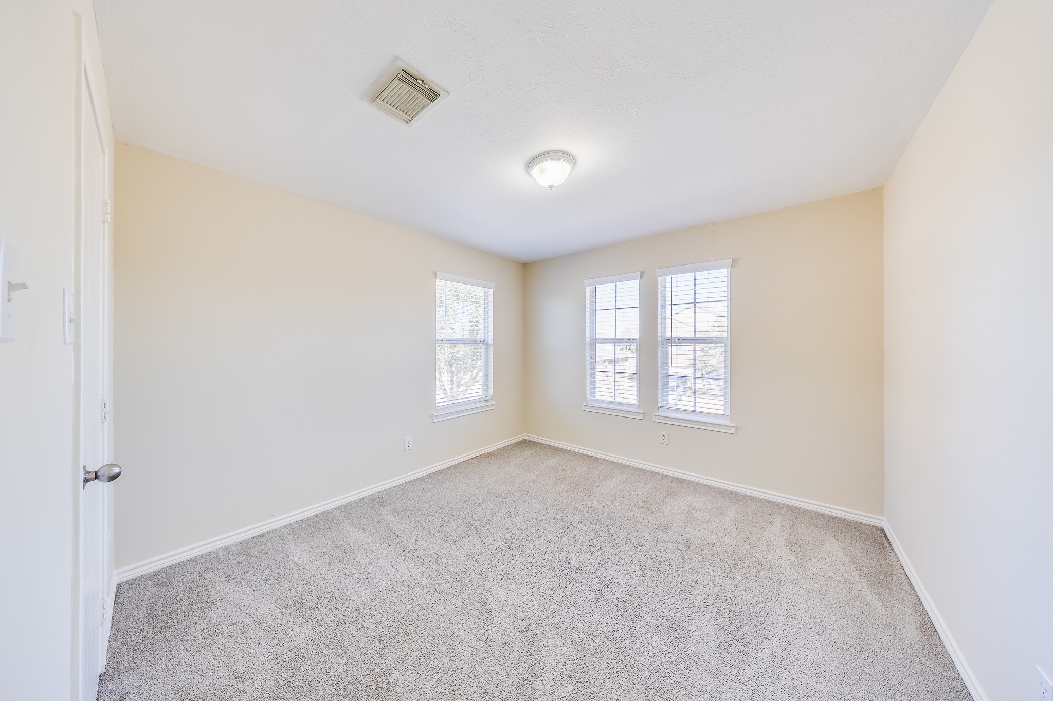 20003 Rustic Lake Lane Cypress, TX 77433 - Photo 15 of 21 a view of an empty room with a window