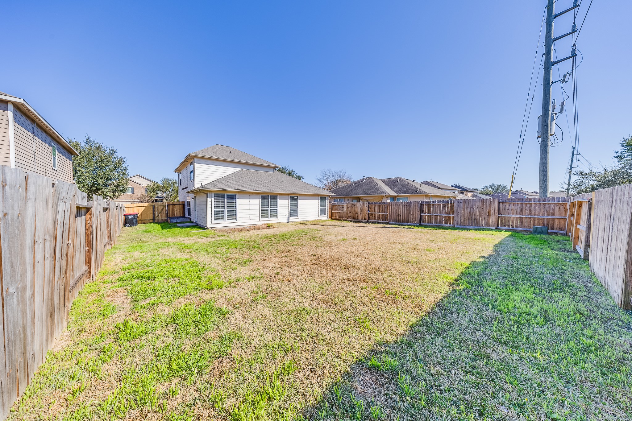 20003 Rustic Lake Lane Cypress, TX 77433 - Photo 20 of 21 a house with swimming pool in front of it