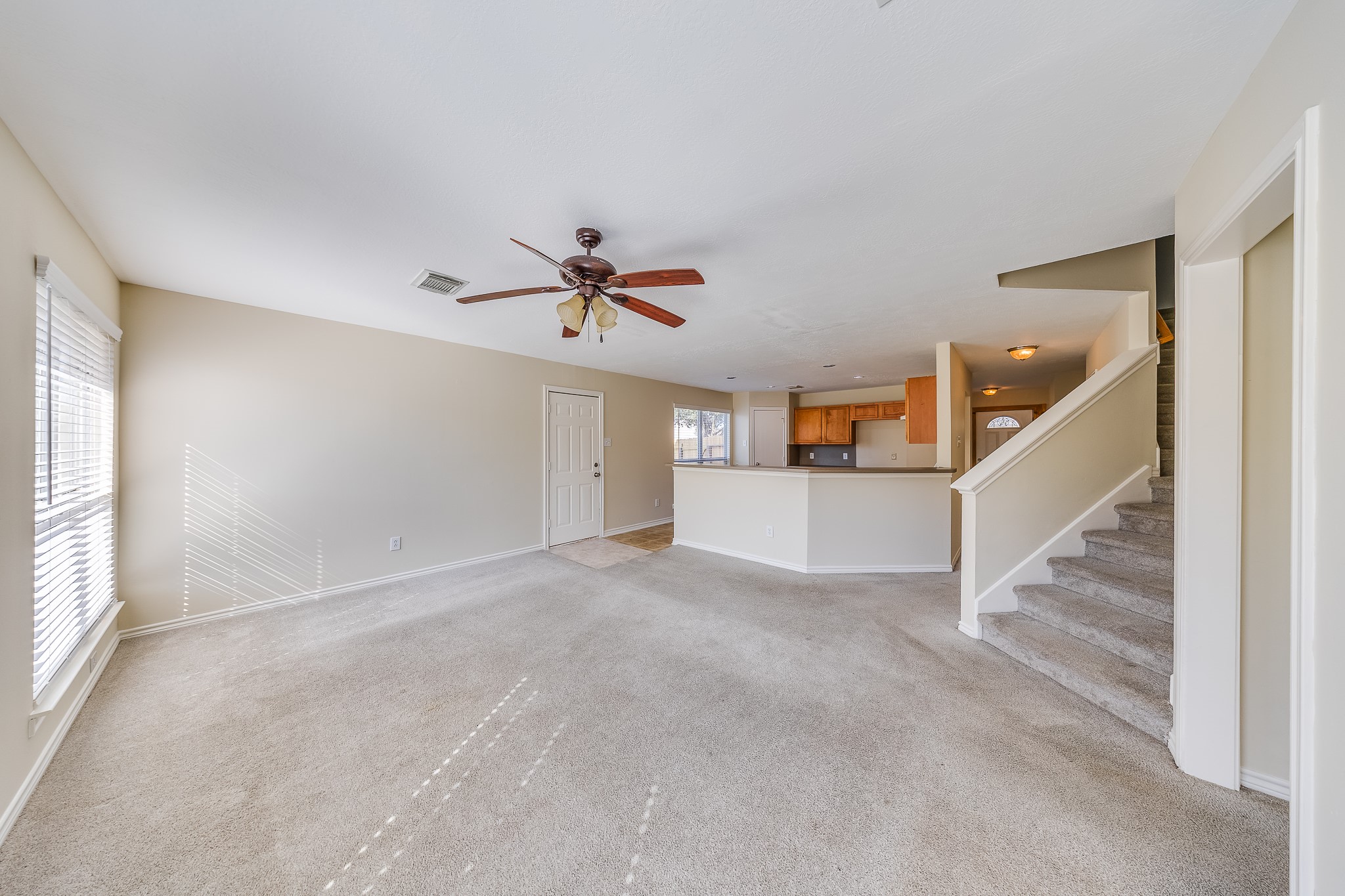 20003 Rustic Lake Lane Cypress, TX 77433 - Photo 3 of 21 a view of a livingroom with a ceiling fan and window