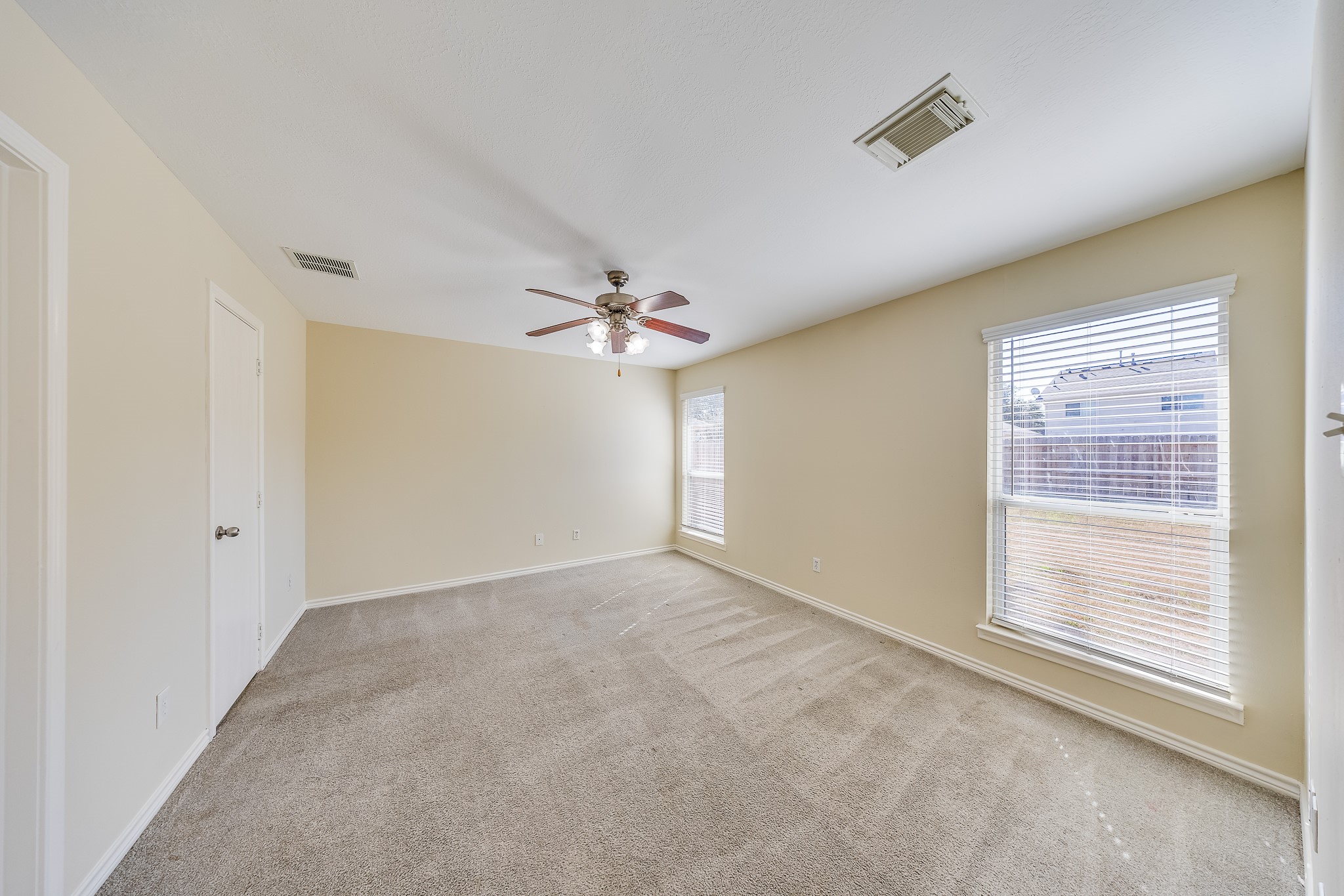 20003 Rustic Lake Lane Cypress, TX 77433 - Photo 7 of 21 a view of an empty room with a window