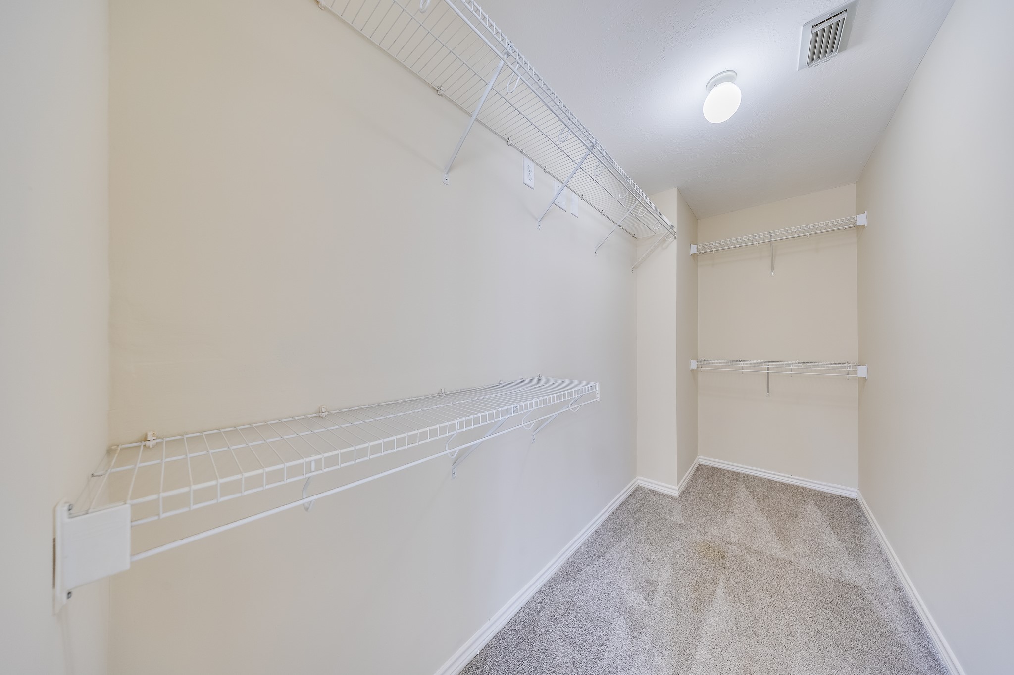 20003 Rustic Lake Lane Cypress, TX 77433 - Photo 8 of 21 a view of an empty walk in closet