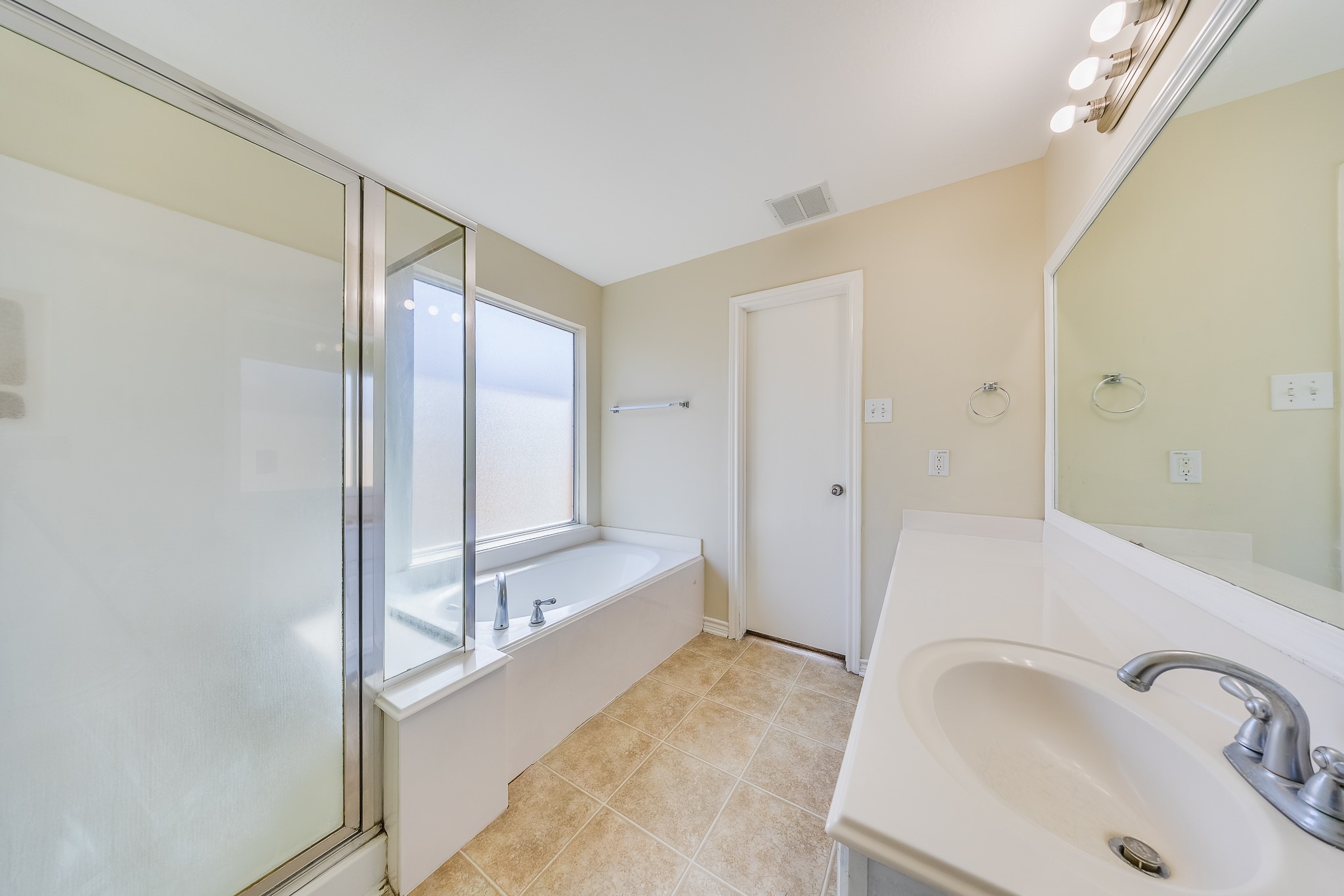 20003 Rustic Lake Lane Cypress, TX 77433 - Photo 10 of 21 a bathroom with a bathtub and a sink
